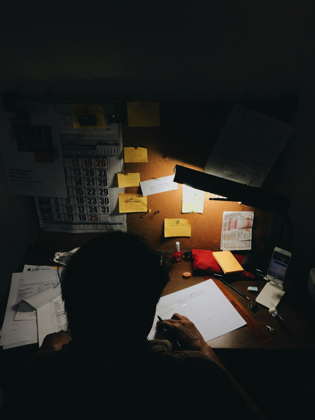writer at desk with notes